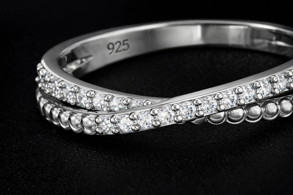 Silver bracelet with gemstones on a black background