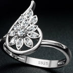 Silver ring with diamond-like stones on a dark background