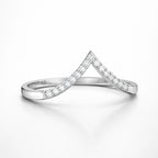Silver ring with diamond accents on a white background