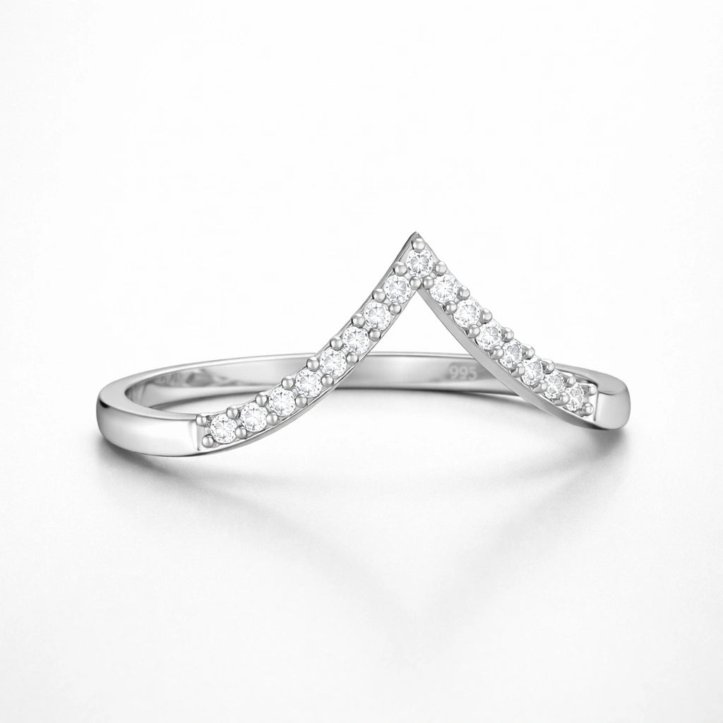 Silver ring with diamond accents on a white background