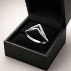 Silver ring with gemstones in a black box