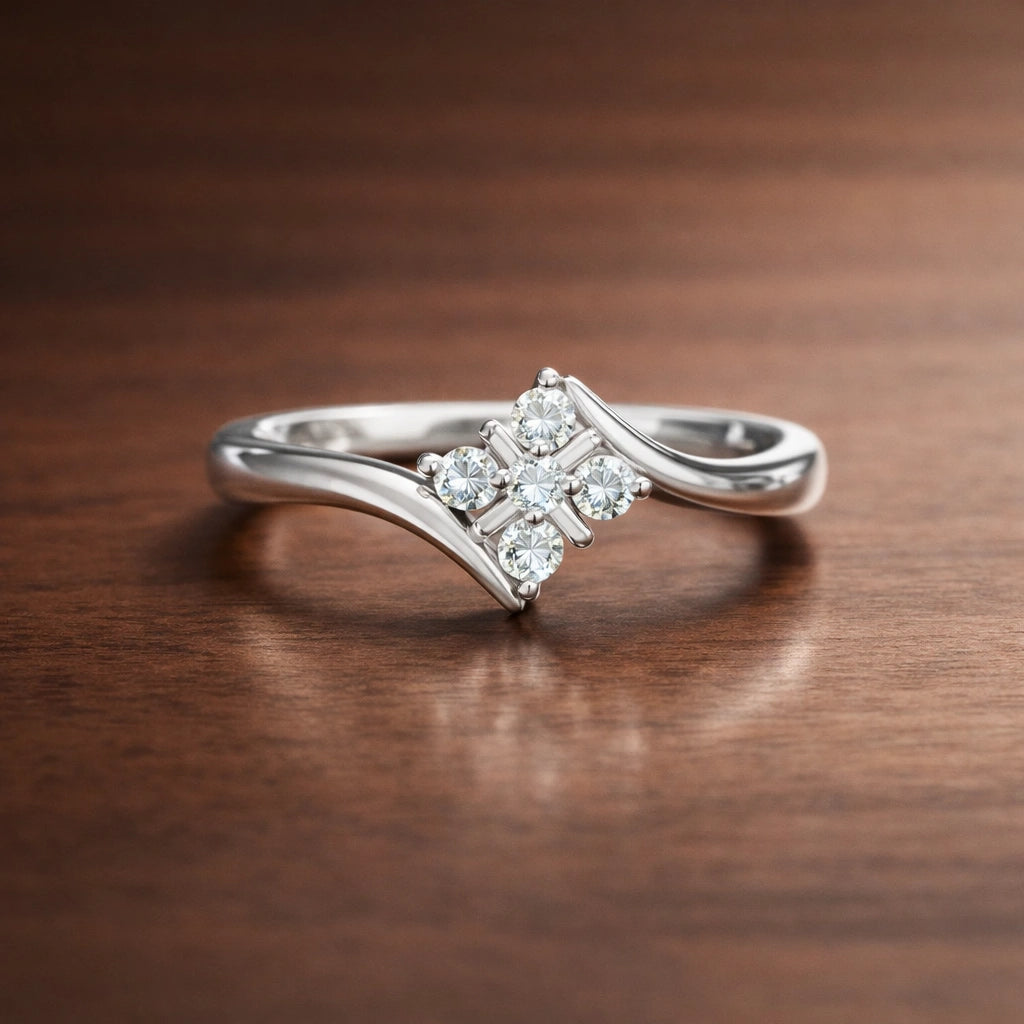 Silver diamond ring on a wooden surface