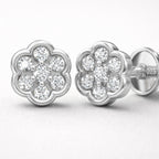 Silver flower-shaped earrings with clear gemstones on a white background