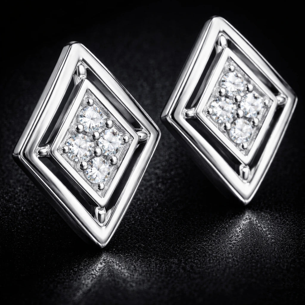 Pair of silver square-shaped earrings with clear gemstones on a dark background