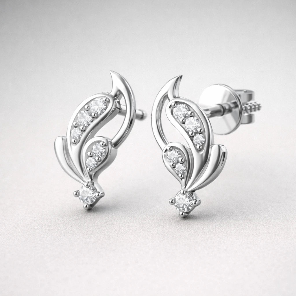 Silver earrings with diamond accents on a light gray background