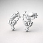 Silver earrings with diamond accents on a light gray background