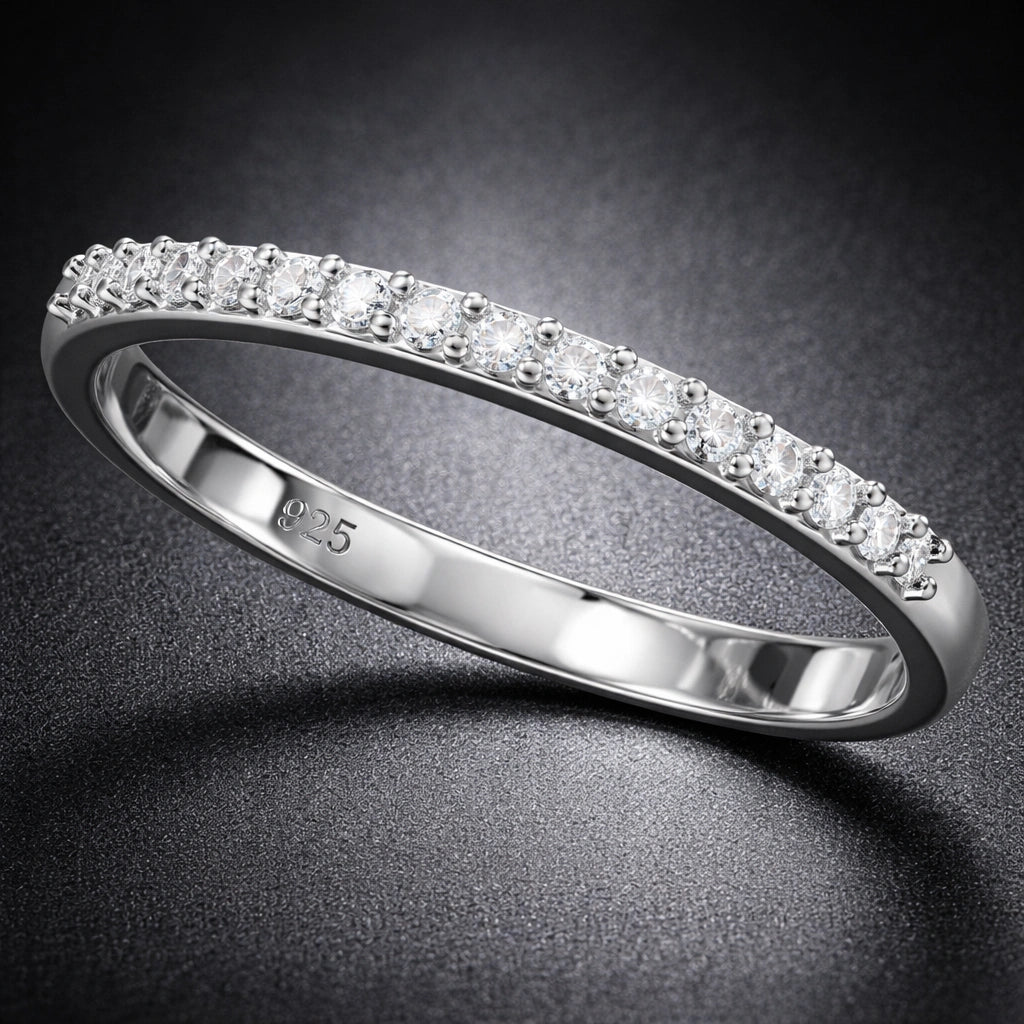 Silver ring with diamonds on a dark background