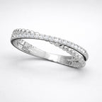 Silver ring with small diamonds on a white background