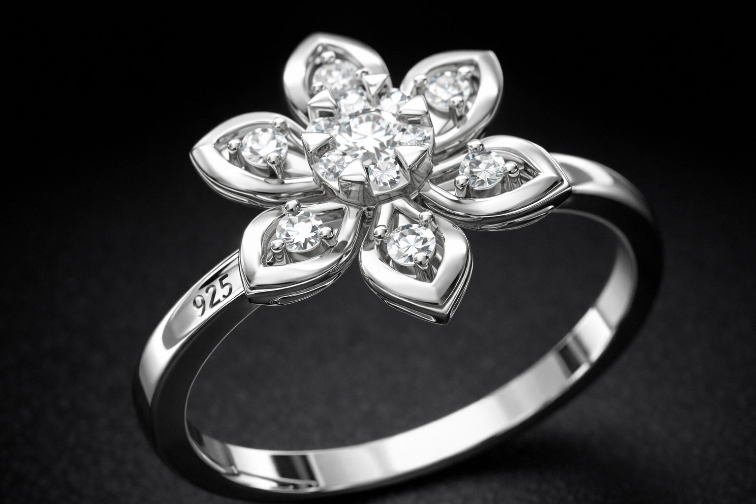 Silver ring with diamond flower design on a dark background