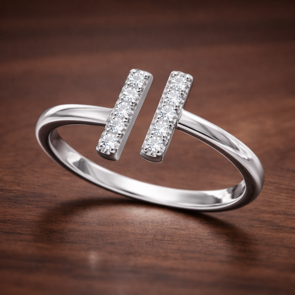 Silver ring with diamond accents on a wooden surface