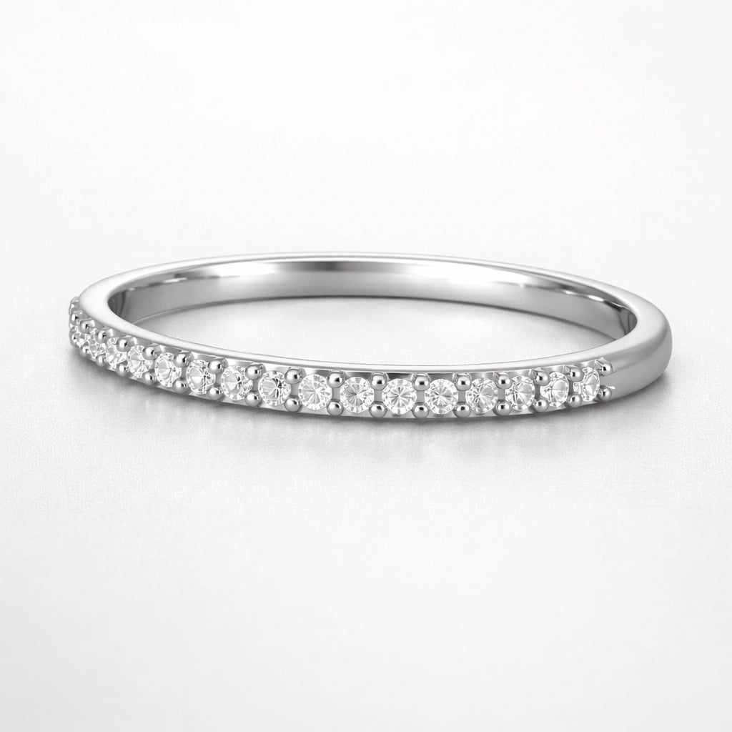 Silver ring with small diamonds on a white background