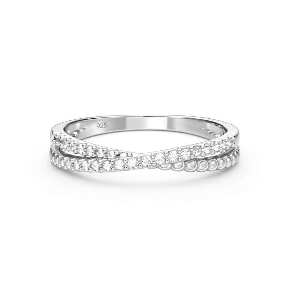 Silver ring with small diamonds on a white background