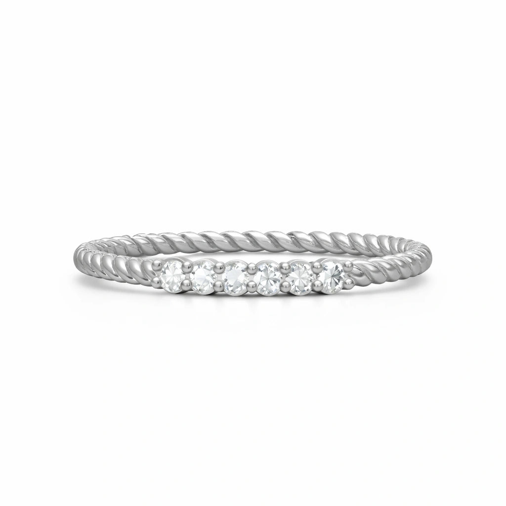 Silver ring with small diamonds on a white background