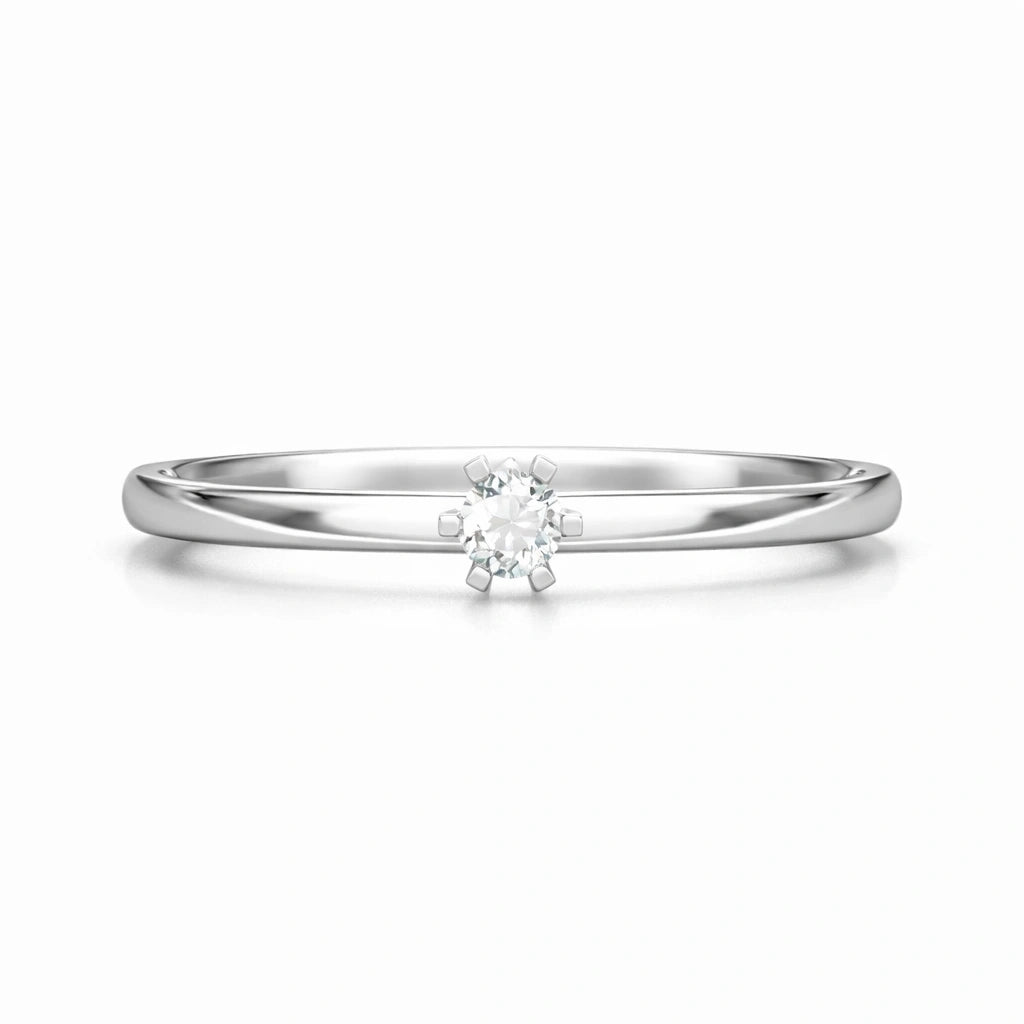 Silver ring with a small diamond on a white background