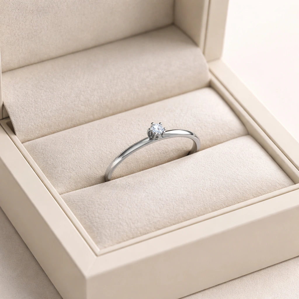 Diamond ring in a beige jewelry box