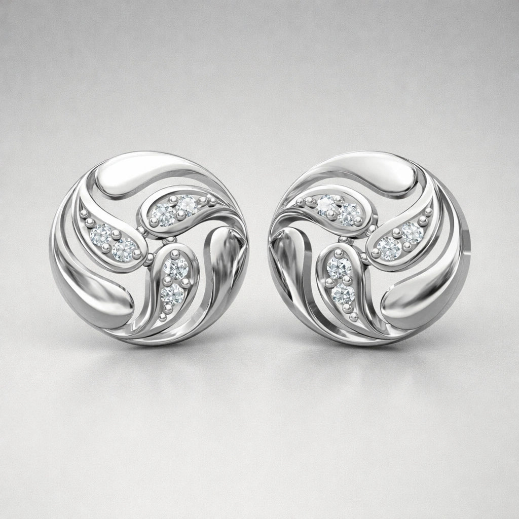 Pair of silver earrings with diamond accents on a light gray background