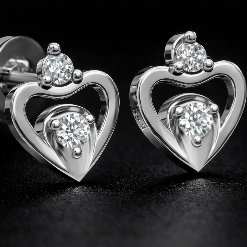 Heart-shaped silver earrings with clear gemstones on a black background
