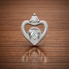 Heart shape diamond stud earring in white gold with open heart design on wooden background