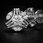 Silver ring with diamond accents on a dark background