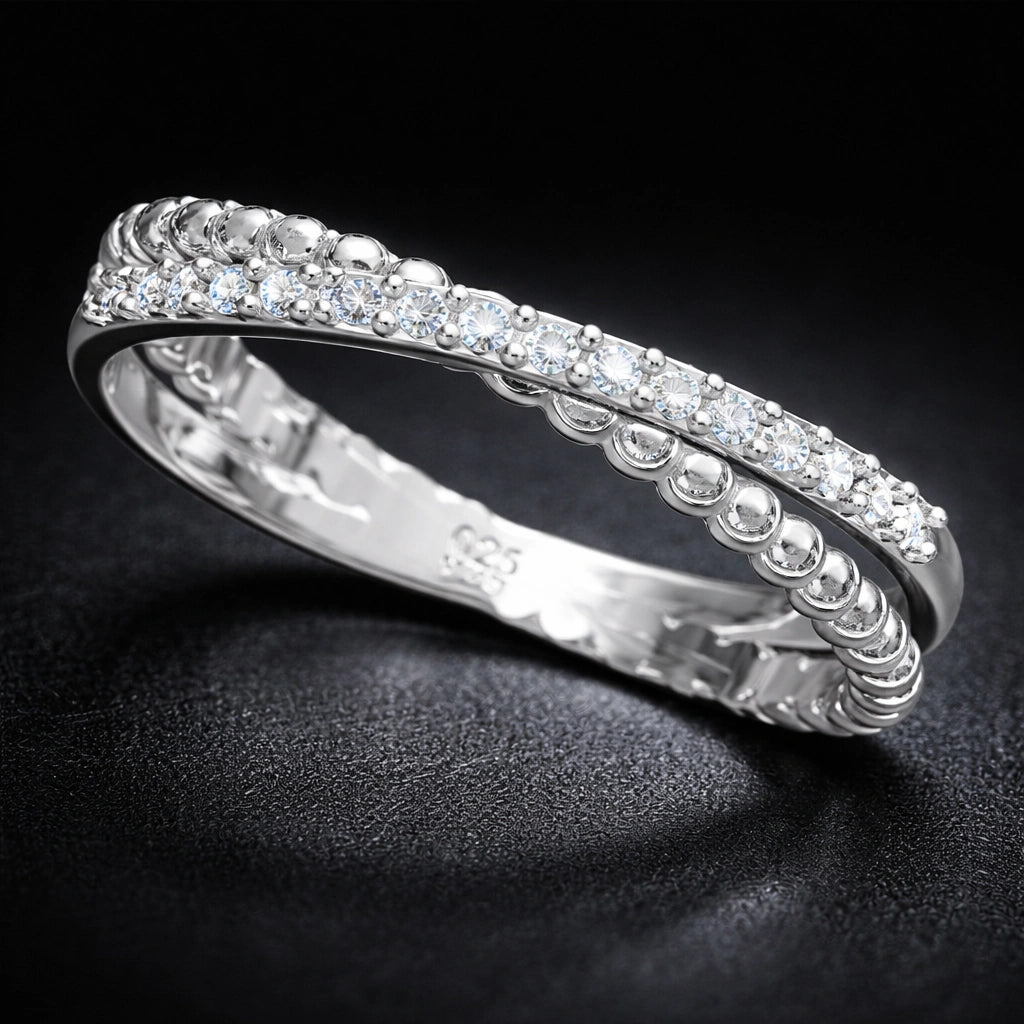 Silver ring with diamonds on a black background