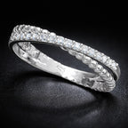 Silver ring with diamonds on a black background